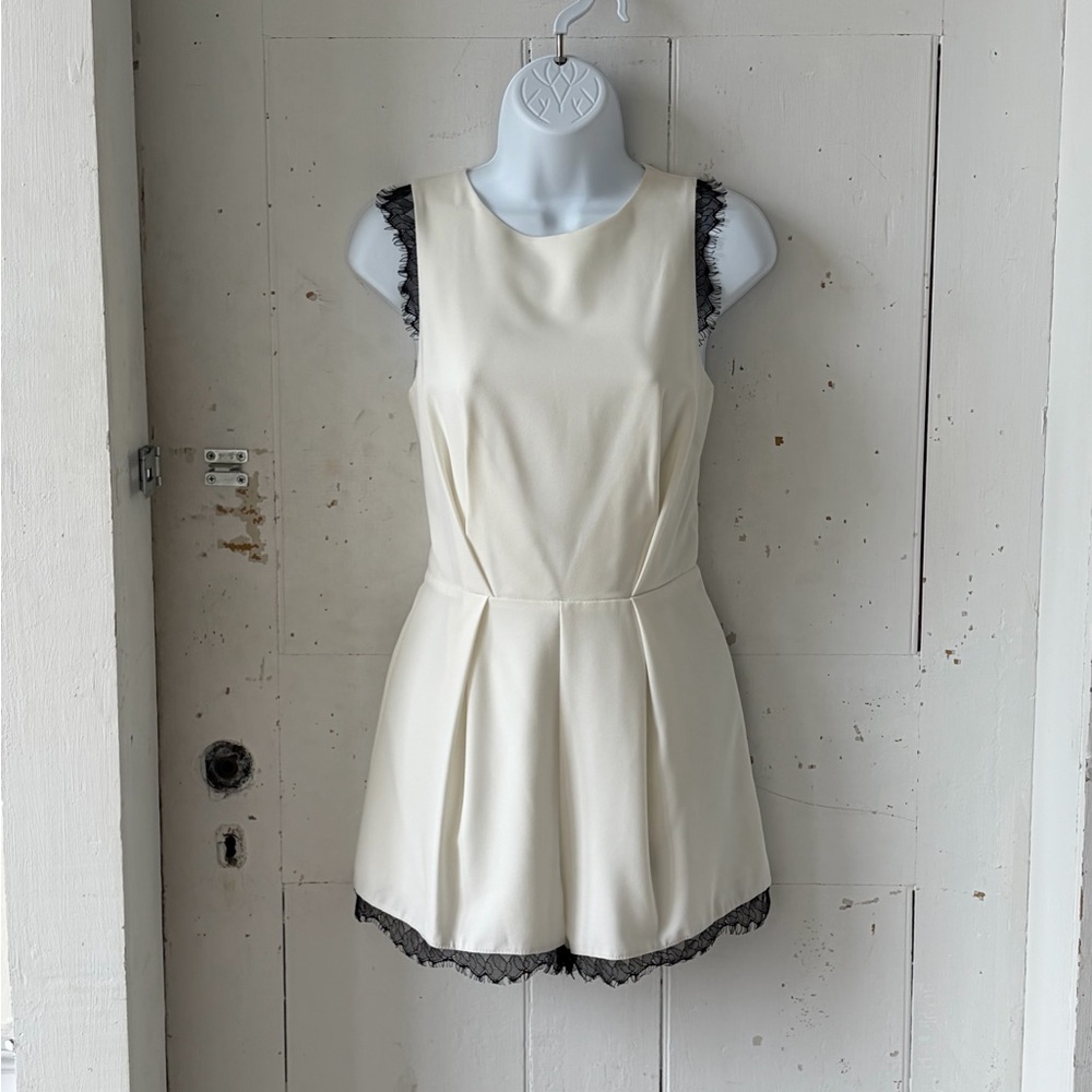 Necessary Objects Cream Sleeveless Romper with Black Lace Trim